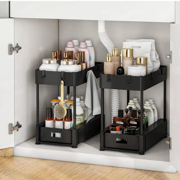 Two black ClearReach two-tier organizers inside an under-sink cabinet